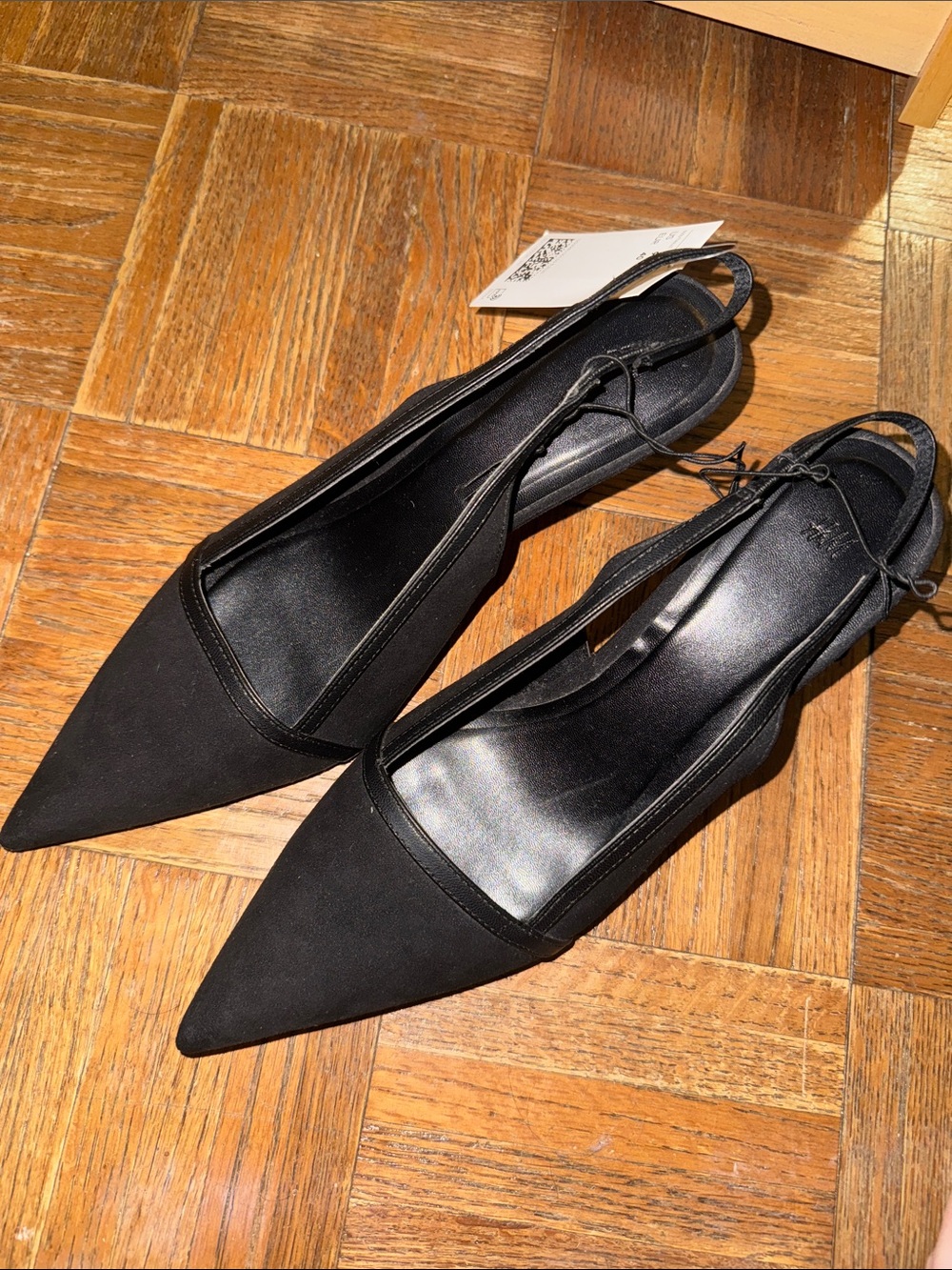 Black pointed toe kitten heels